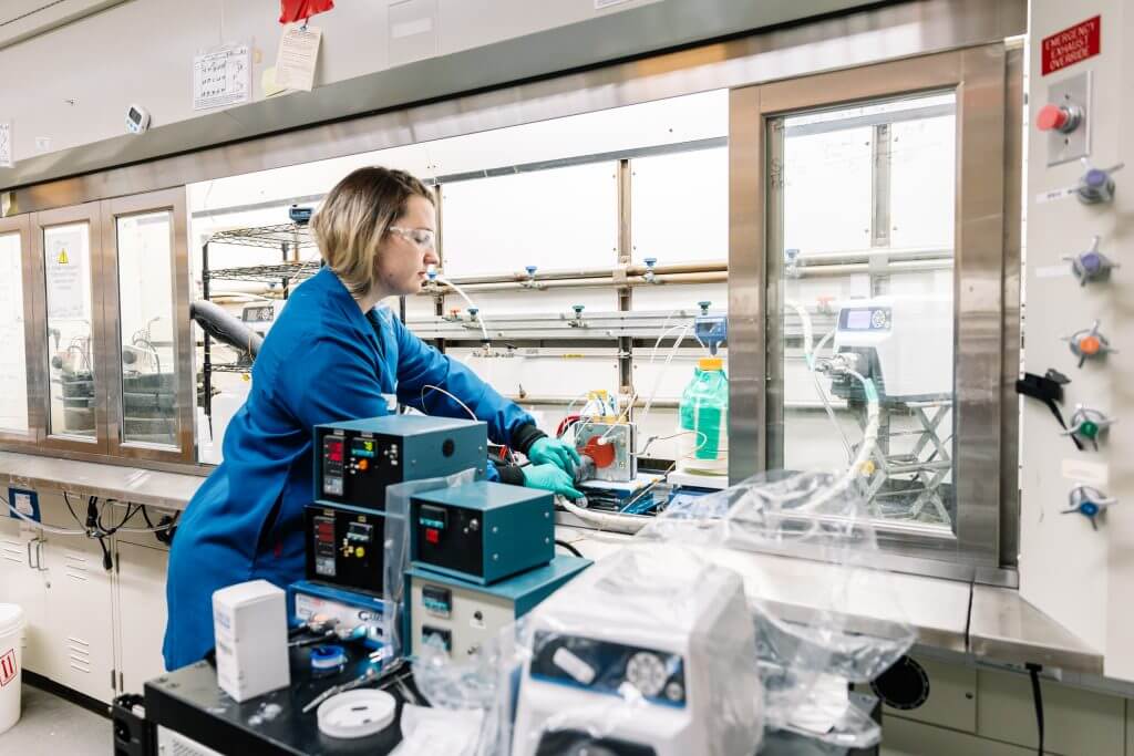 Female scientist working in fume hood in Innovation Space lab